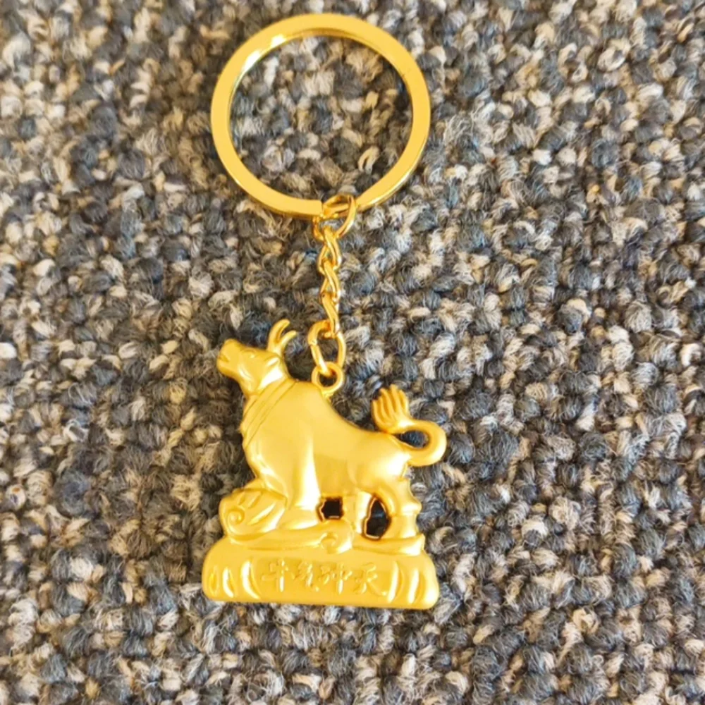 Good luck Cow keychain gold tone